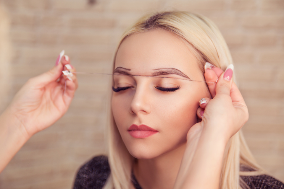 A woman getting ready for her microblading treatment.