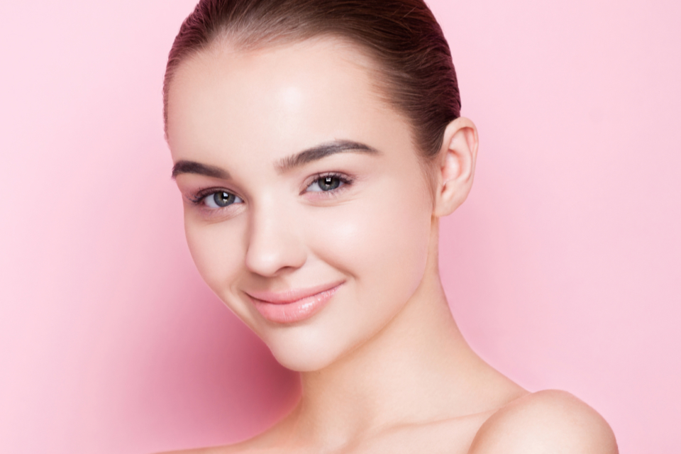 A woman with glowing white skin.